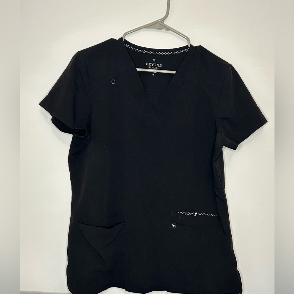 Set of four beyond scrub brand scrubs